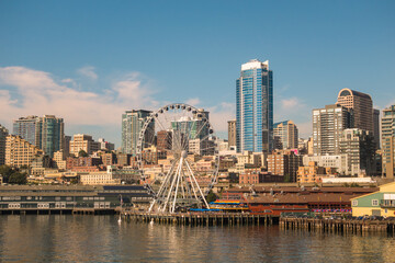 Fototapeta na wymiar Seattle skyline with Waterfront neighborhood and ferris wheel in foreground.