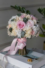 Wedding bouquet of white and pink flowers on the table.