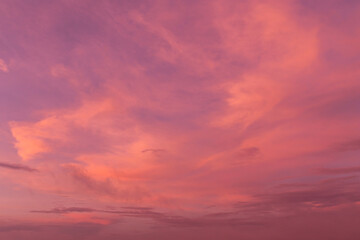Epic Dramatic soft sunrise, sunset orange sky with cirrus clouds in sunlight abstract background texture