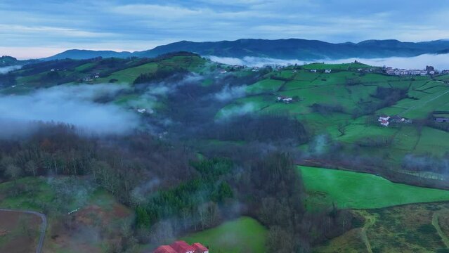 Aerial drone view of the winter landscape around the town of Gainza and Amezqueta and the Txindoki Mountain. Aralar Mountain Range. Goierri region. Gipuzkoa. Basque Country. Spain. Europe