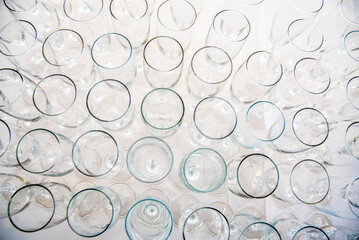 A pile of glasses on a white table