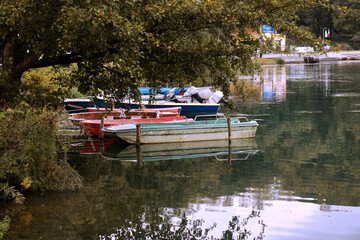 Fototapeta na wymiar small wooden boats on the Adda river.