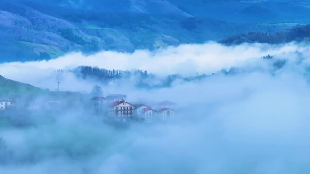 Aerial drone view of the winter landscape around the town of Gainza and Amezqueta and the Txindoki Mountain. Aralar Mountain Range. Goierri region. Gipuzkoa. Basque Country. Spain. Europe