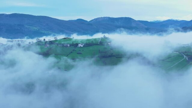 Aerial drone view of the winter landscape around the town of Gainza and Amezqueta and the Txindoki Mountain. Aralar Mountain Range. Goierri region. Gipuzkoa. Basque Country. Spain. Europe