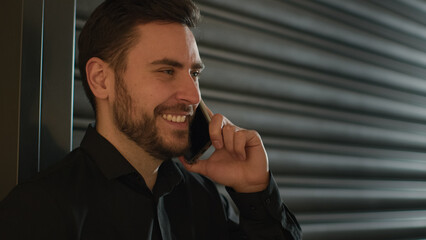 Caucasian office worker businessman commercial CEO cheerful entrepreneur talking mobile phone speak smartphone business call at workplace calling cellphone negotiate smiling man talk discuss indoors