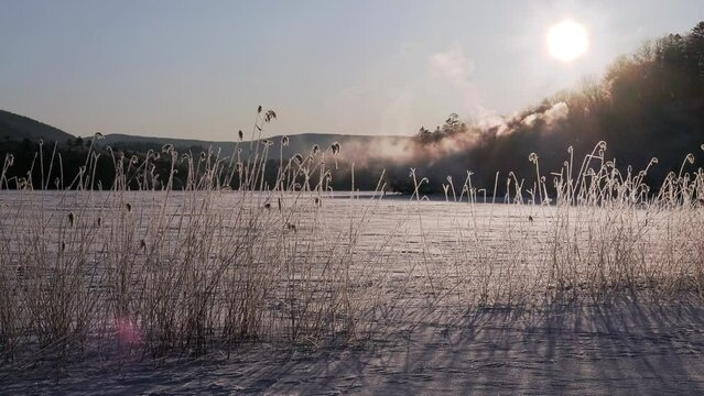 Hokkaido, Japan - January 30, 2024: Diamond dusts
 on the frozen Lake Akan in Hokkaido, Japan