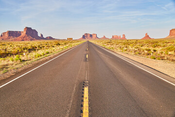 Fototapeta na wymiar Desert Highway to Monument Valley, Clear Sky, Road Perspective
