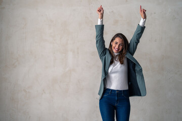 Youth and freedom, charming woman with hands in the air to dance, stream music and celebrate on...