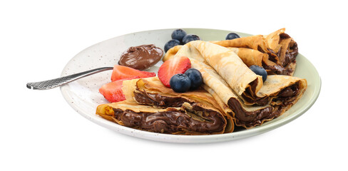 Tasty crepes with chocolate paste, berries and spoon isolated on white