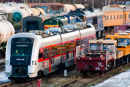 Riga, Latvia &ndash; January 11, 2024: electric trains, diesel locomotives and carriages at the railway station