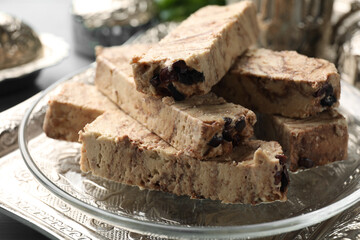 Pieces of tasty chocolate halva on tray, closeup