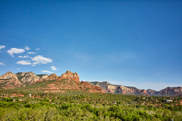 Fototapeta na wymiar Sedona Red Rock Cliffs with Greenery and Homes, Elevated View