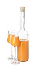 Bottle and glasses with tasty tangerine liqueur isolated on white