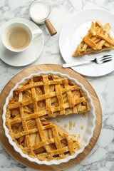 Tasty homemade quince pie served on white marble table, flat lay