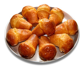 Neapolitan baba rum in round tray isolated