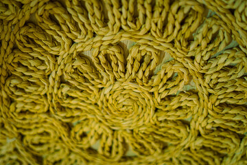 Yellow hanging wall tapestry as a background. 