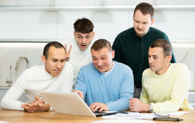 Fototapeta premium Group of friends communicate via video conference using laptop