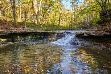 Obraz premium Autumn Waterfall in Woodland Serenity, Hathaway Preserve - Eye-Level View