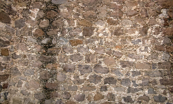 Background of old wall made of rocks in Mexico, with space for text