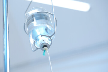IV drip in hospital, low angle view. Space for text