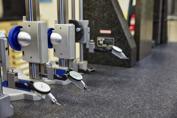 Precision Measurement Tools on Granite Surface in Industrial Setting