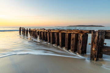 The Victor Harbor erosion groyne with a long exposure and granite island in background and pastel...