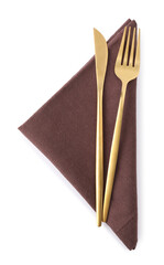 Brown napkin with golden fork and knife isolated on white, top view. Cutlery set