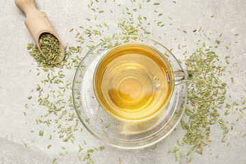 Aromatic fennel tea and seeds on light grey table, flat lay - obrazy, fototapety, plakaty