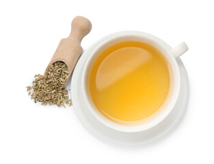 Aromatic fennel tea in cup, seeds and scoop isolated on white, top view
