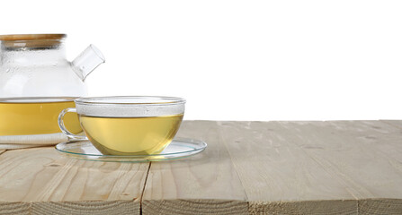 Refreshing green tea in cup and teapot on wooden table against white background