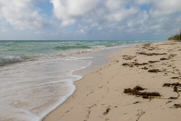 Breaking waves on a sandy beach