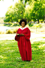 Middle-aged African American Woman Outdoors In Church Robes