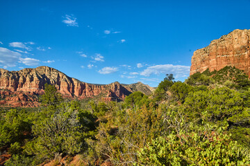 Majestic Red Rock Cliffs and Green Forest in Sedona