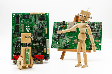 Pequeños robots hechos con madera y tornillos, delante de un circuito electrónico, aislado en...