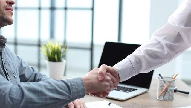A male office worker is scattering papers