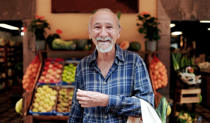 Asian senior man shopping at farm market. Customer buying at grocery store. Small business concept