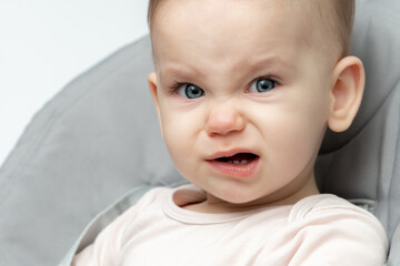 Hungry and tired baby crying, a call for attention. Concept of basic infant care