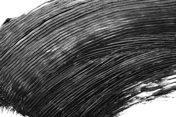Smear of black mascara isolated on white, top view