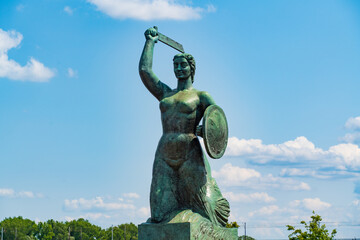 Statue of Syrenka, the Warsaw Mermaid, at Vistula River bank in Warsaw, Poland © momo11353