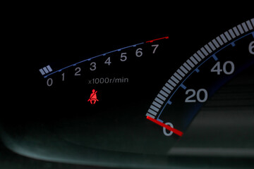 Under exposure photo of car's speedometer. After some edits.