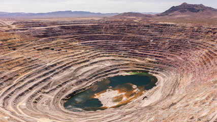 Aerial view of an exhausted open pit copper mine near Ajo, Arizona, USA.