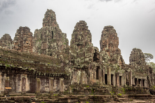 Stone beautiful temple ruin building architecture in Bayon complex Angkor Wat in Seim Reap Cambodia on a cloudy overcast day