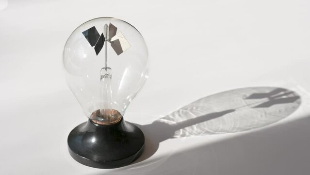 Crookes radiometer starts to spin evoquing the start of a new era of renewable energy