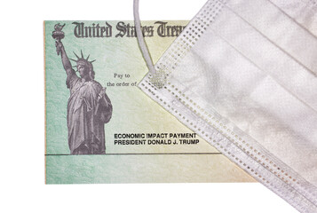 Close up of a United States Treasury Economic Stimulus Check with a face mask