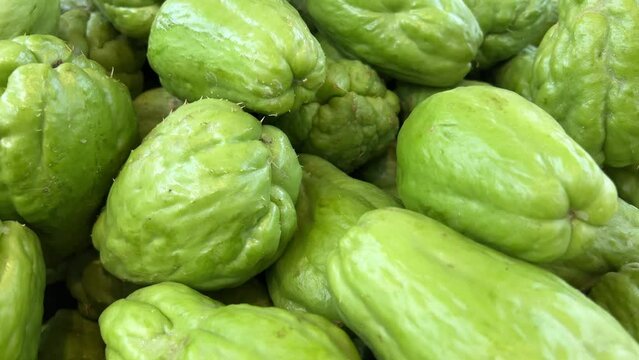 Fresh vegetables Chayote. Chuchu. vegetables and fruits on the counter in a supermarket or market in Vietnam High quality 4k footage