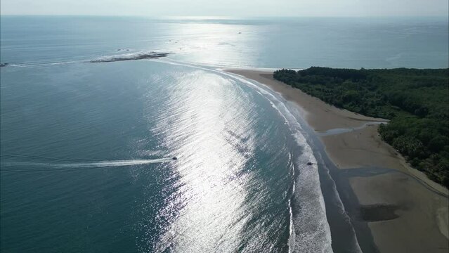 Boat sailing into the shore of Costa Rica during the dat
