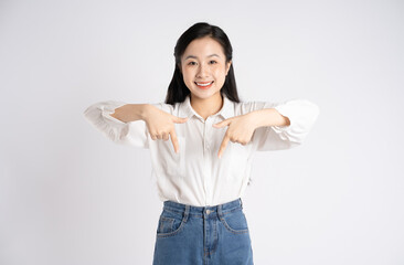 Portrait of young Asian businesswoman posing on white background