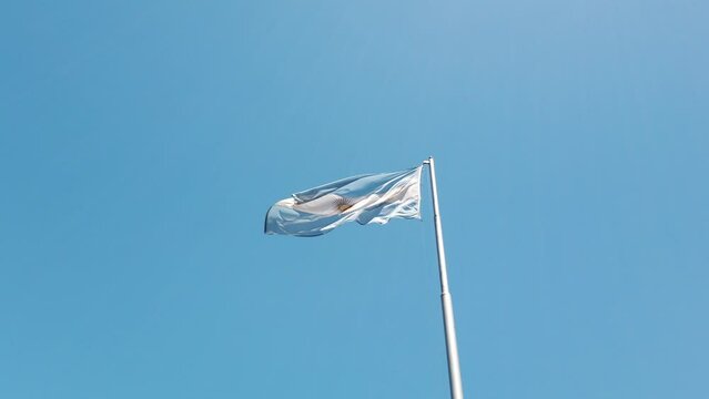 National Flag of Argentina Waving over the Blue National Sky in South America