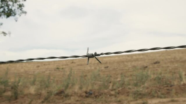 A boarder fence with barbwire