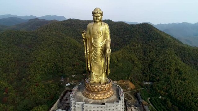 Aerial photography of Buddha statues on mountaintops in Asia